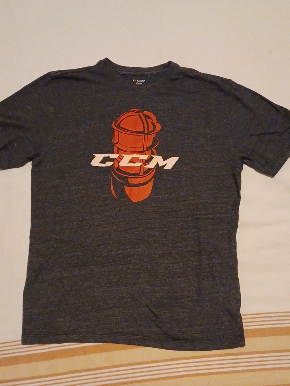 CCM Heather Navy Short Sleeve Tee with Orange Logo